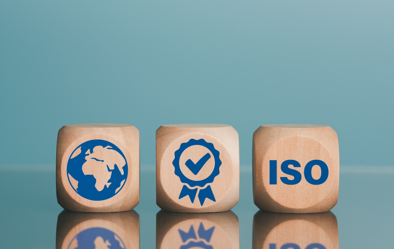 ISO 9001 – Clause 4- best quality business idea Management and improvement of excellent products and services to develop industry standards for success The wooden blocks are placed on the table.